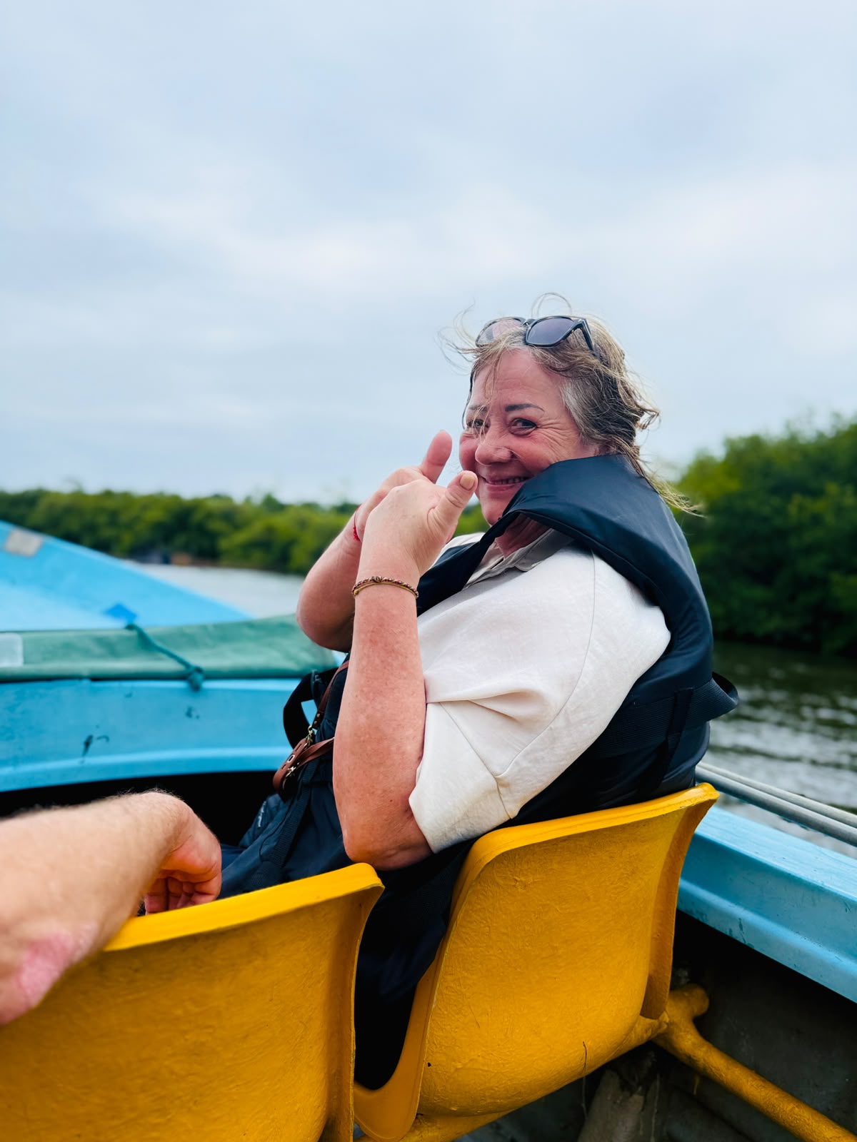 Smiling traveler on a mangrove boat ride